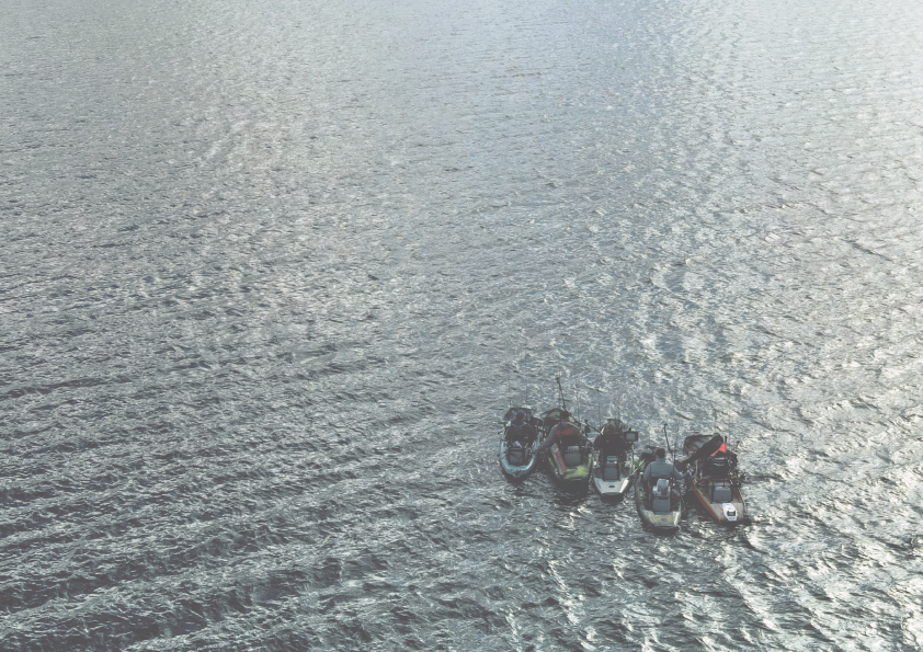 Five fishing kayaks on the open sea, Hobie kayaks